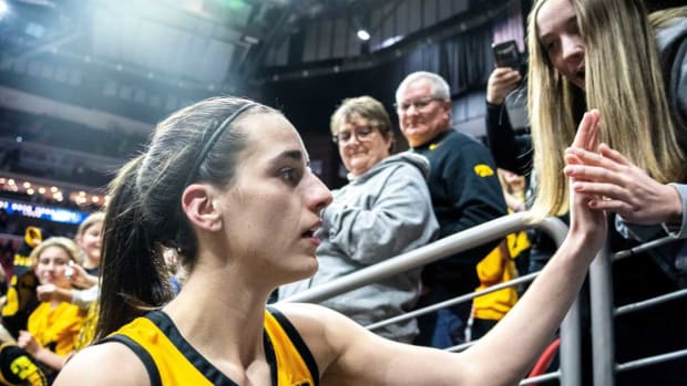 Iowa guard Caitlin Clark greets fans after defeating Cleveland State during the Hawkeye Showcase at Wells Fargo Arena in Des Moines, Iowa on Dec. 16, 2023.